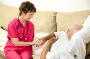 Nurse providing a helping hand to a patient while at home